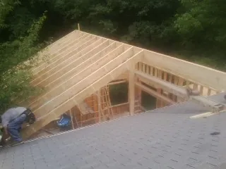 Framing a new roof addition that ties into an existing shingle roof in Roseville